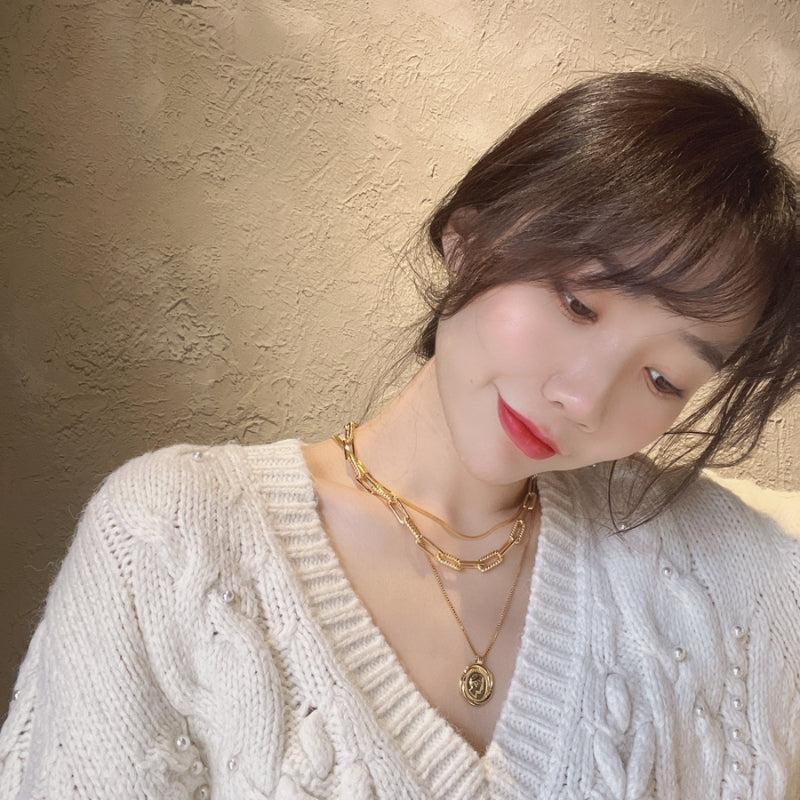 女王像コインツイストネック