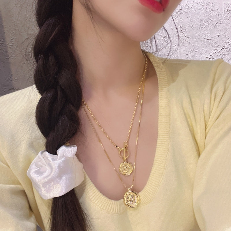 女王像コインツイストネック
