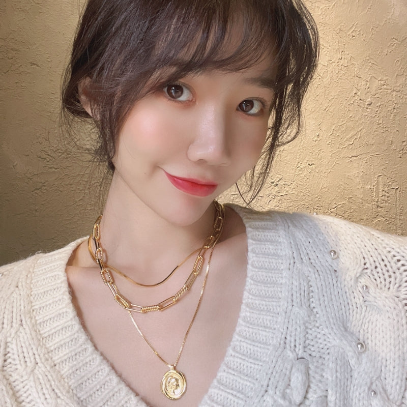 女王像コインツイストネック